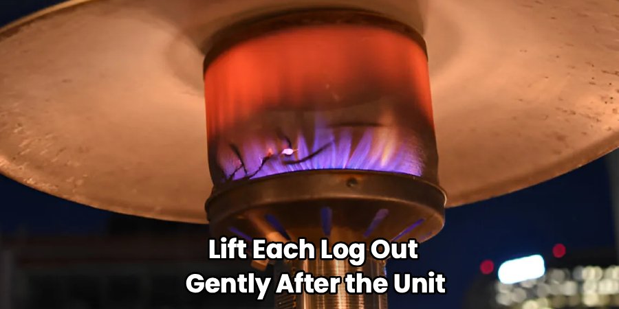 Lift Each Log Out 
Gently After the Unit