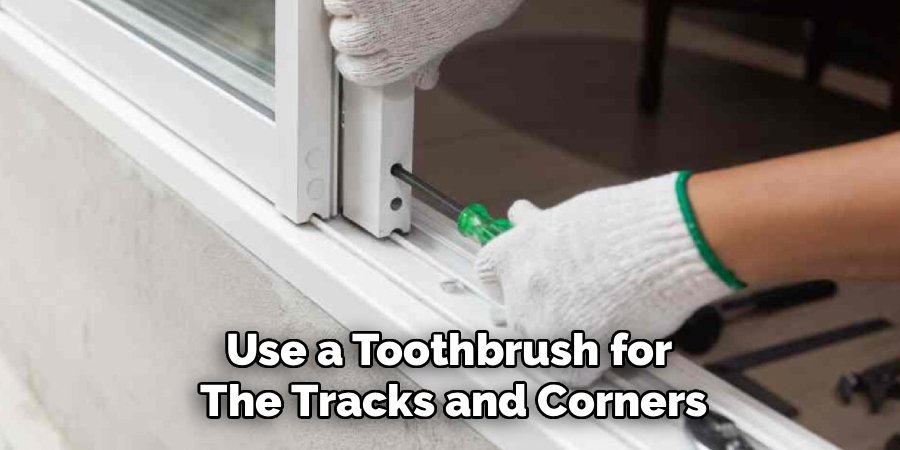 Use a Toothbrush for 
The Tracks and Corners