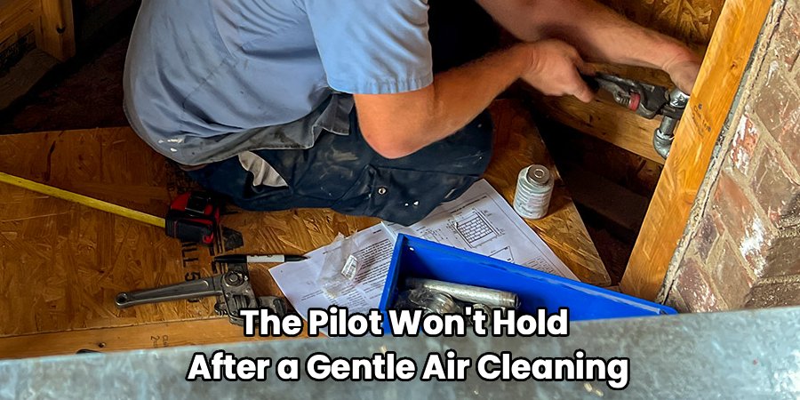 the pilot won't hold after a gentle air cleaning